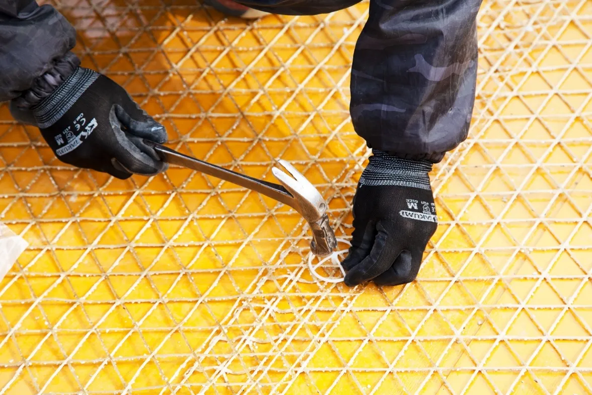 Sandy Aramid Mesh Method Sheet affixed to the inner surface of formwork